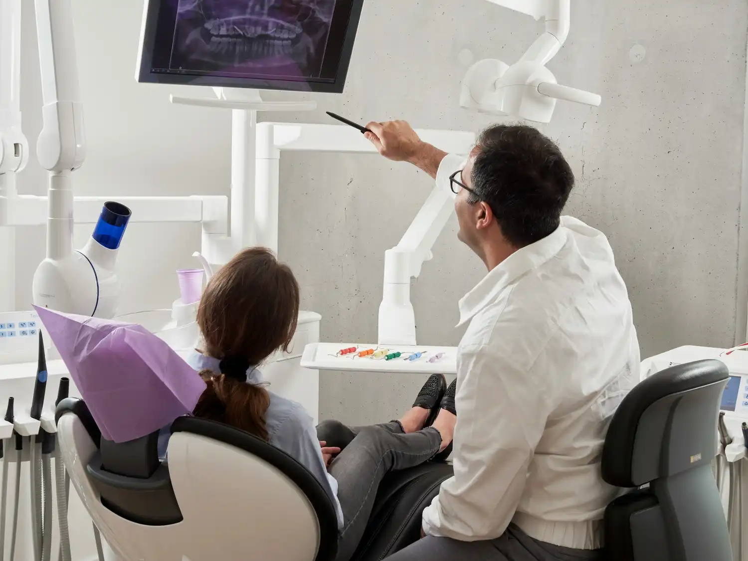 Dentist consulting a patient